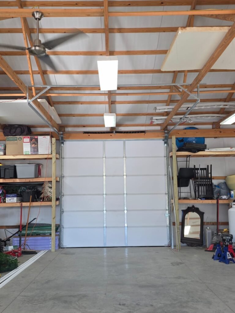New insulated garage door with fresh tracks fitted inside a customer’s garage