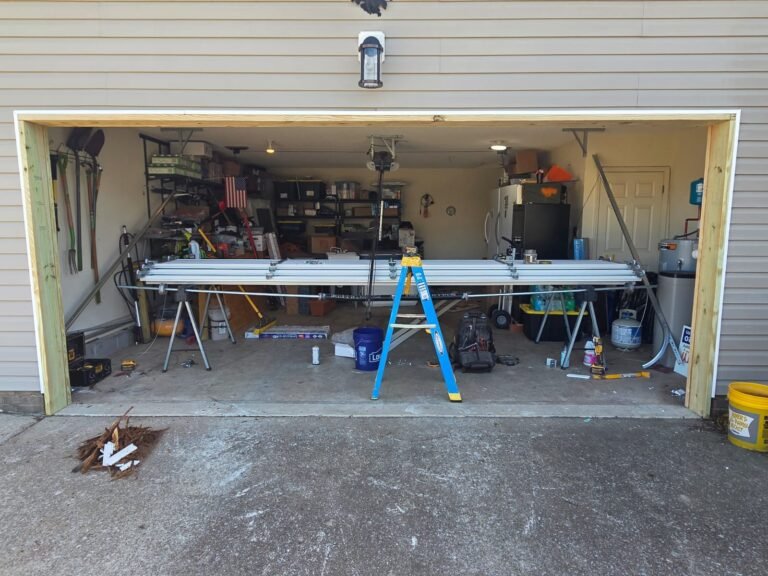 New garage door sections staged for installation in a customer’s garage