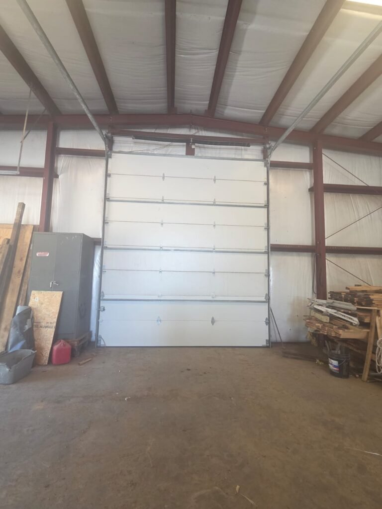 Oversized commercial sectional door inside a steel building